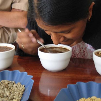 Female Guatemalan coffee farmer cupping their coffee