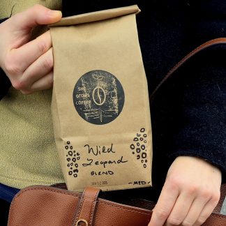 A view of the Wild Leopard Blend bag, decorated with bespoke spotted leopard pattern.